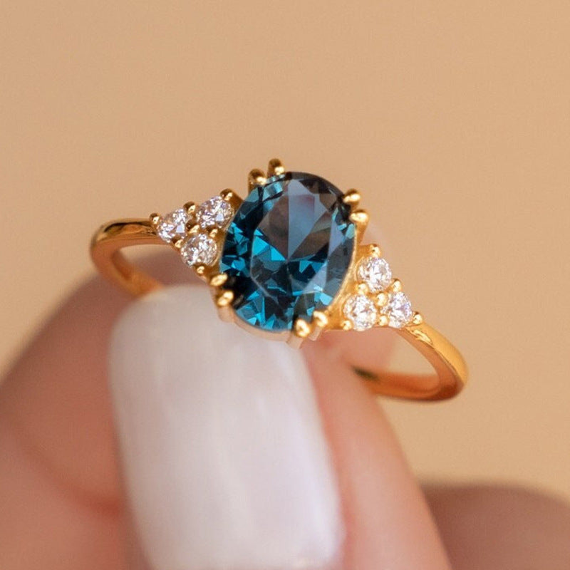 Oval Blue Topaz Gold Ring